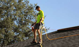 Photo of roofing marketing client working in the field