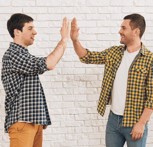 Two guys high fiving