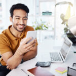 Photo of man holding phone during marketing strategy consultation