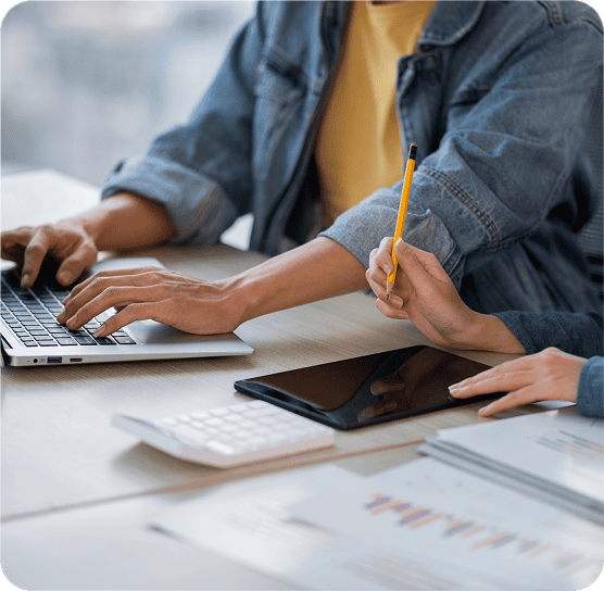 Photo of people working at a desk